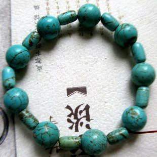 用汉代圆珠与米粒珠间隔穿成的绿松石手串